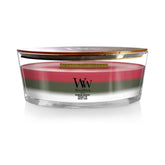 WoodWick front view of ellipse candle showing winter garland labels and festive look
