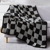 WRENSONGE folded throw on couch showing check pattern and cozy appeal