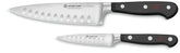 Wüsthof 6-inch chef knife front view showing balanced design and versatile cutting benefit