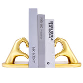 Xmeden front view of gold heart-hands bookend showing elegant shape and support benefit