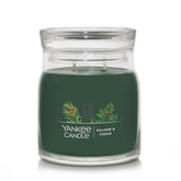 Yankee Candle front jar view showing balsam cedar fragrance and seasonal appeal