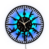 YiJaLyn front view of guns vinyl clock showing bold silhouette and time readability