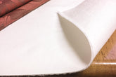 Yourtablecloth front view of 52x140 pad showing white vinyl surface and benefit of spill protection