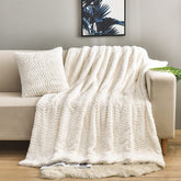 YUSOKI ivory throw front view showing plush double-sided texture and elegant warmth