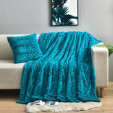 YUSOKI teal throw draped on sofa showing plush decor appeal