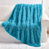 YUSOKI front view showing teal faux fur and inviting texture for comfort