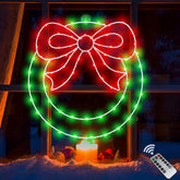 Zimati wreath front view on window glowing for holiday curb appeal