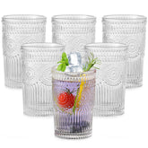 ZMOWIPDL set front view showing six clear flower-embossed glasses and straws, elegant serving