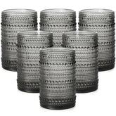 ZMOWIPDL front view of six grey hobnail glasses showing cohesive set and style
