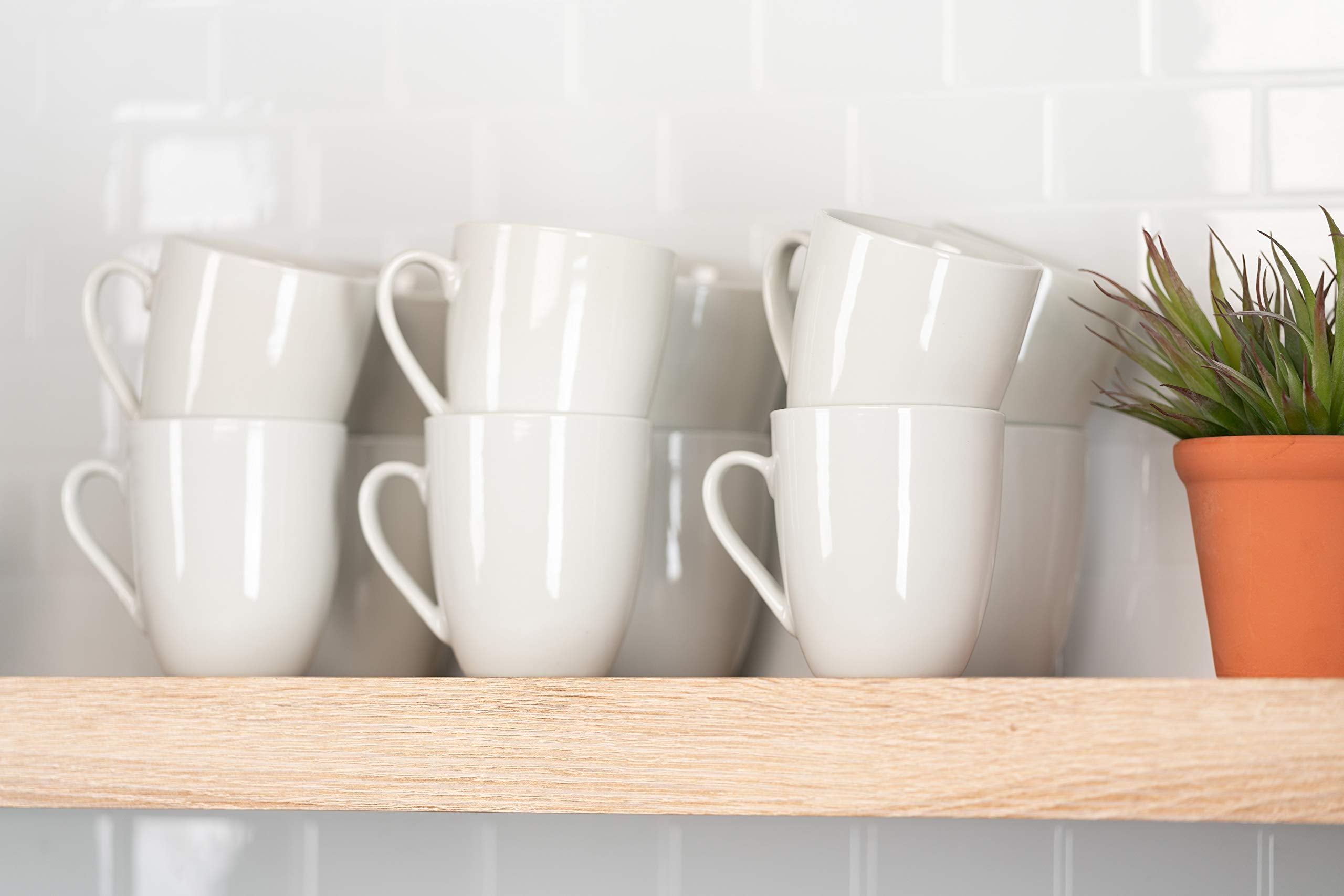 10 Strawberry Street mug held in hand showing comfortable handle and practical size