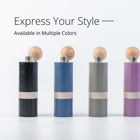 1Zpresso Q Air in hand while grinding to show ergonomic comfort and control