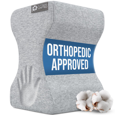 5 STARS UNITED knee pillow positioned on bed demonstrating stable overnight support