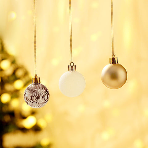 5th LILY hand holding ornaments for size comparison and easy-hang benefit