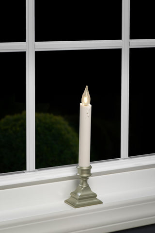 612 Vermont candle held by hand beside ruler showing 9-inch height and compact size for windowsills