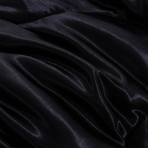 A Nice Night comforter in hand showing lightweight, easy handling