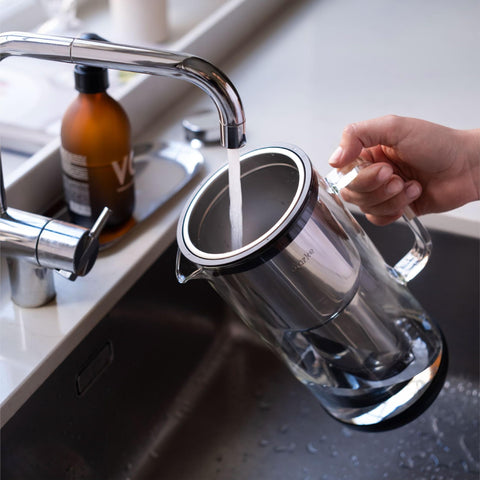 Aarke Purifier on kitchen counter in lifestyle setting for stylish hydration benefit