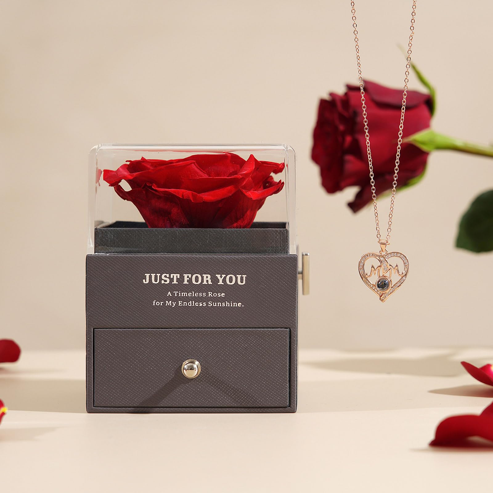 ADDWel open gift box arranged to show rose, necklace, and music box together