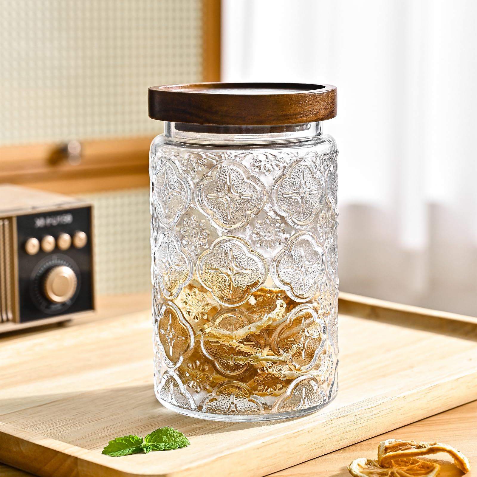 Adodeen jar held in hand to show 32oz scale and portion control benefit