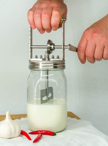 aeaker family kitchen lifestyle depicts hands-on activity teaching kids food skills