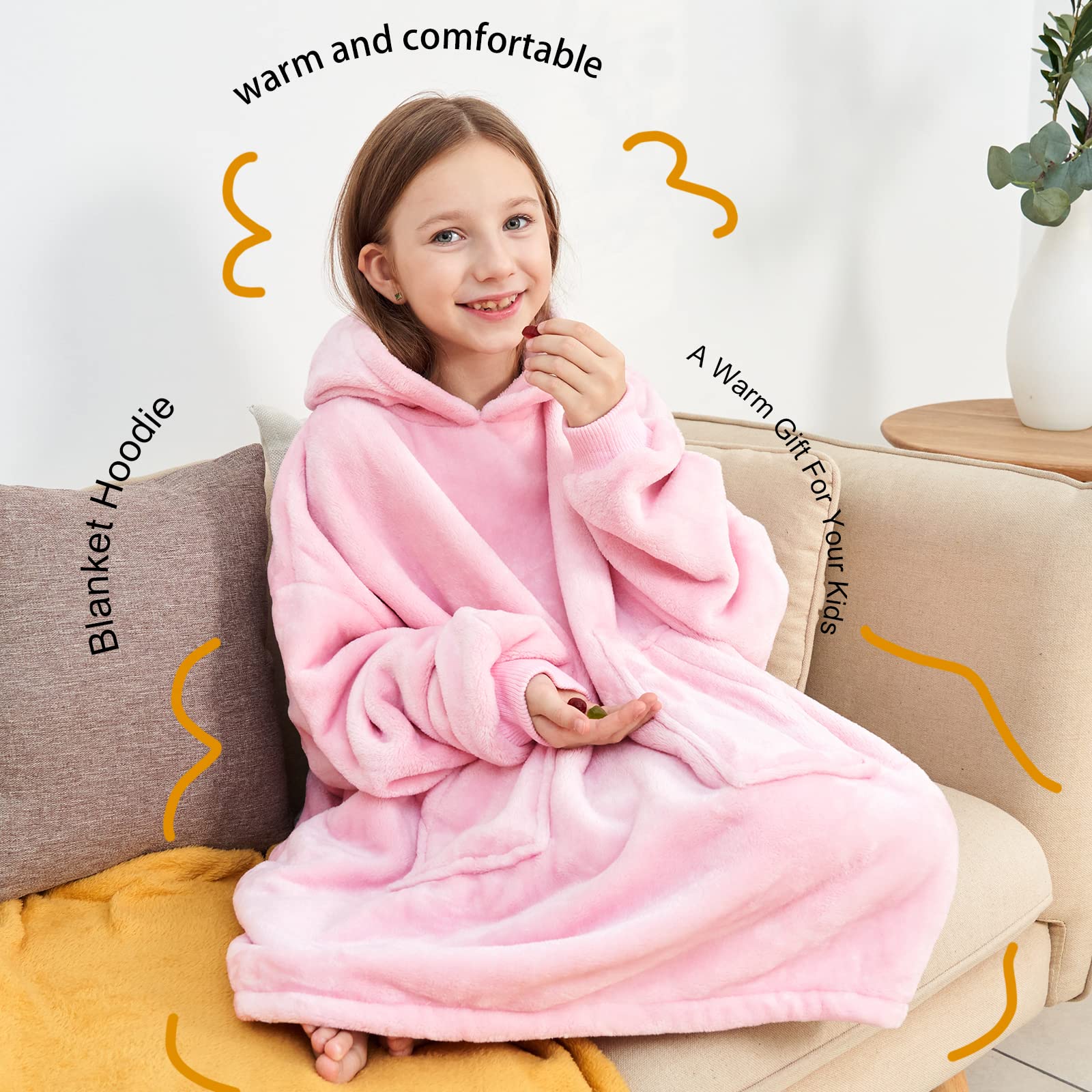 Child wearing Aemicion blanket hoodie while lounging to show active comfort and coverage