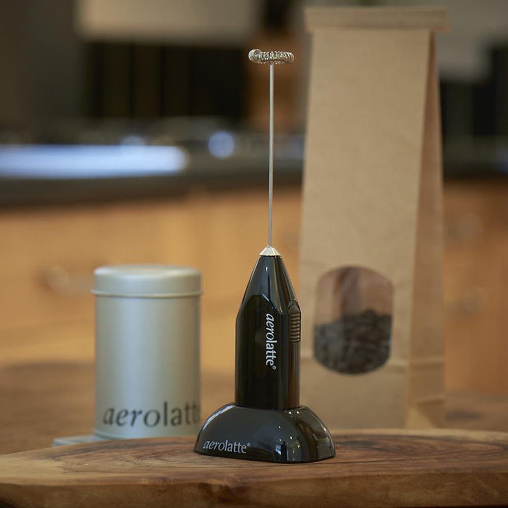 Aerolatte frother creating foam in a mug to quickly upgrade homemade coffee