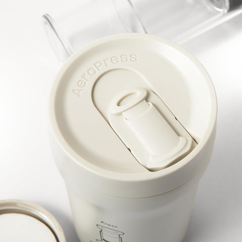 AeroPress Go Plus held in hand to show scale and portability benefit