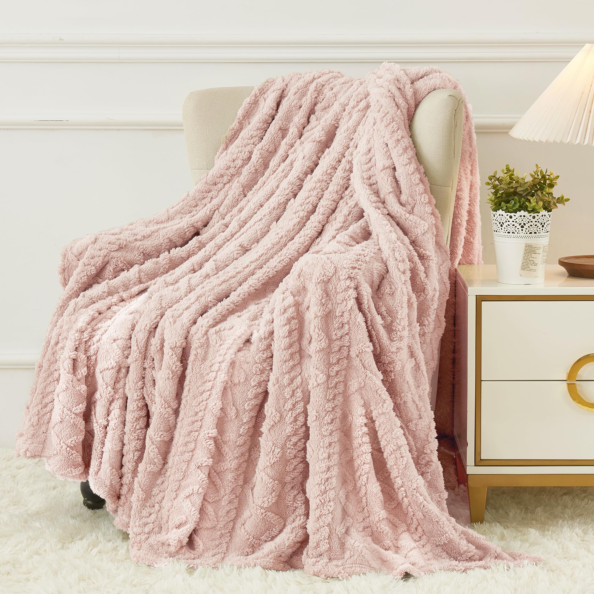 Aganear pink throw front view showing a soft decorative accent