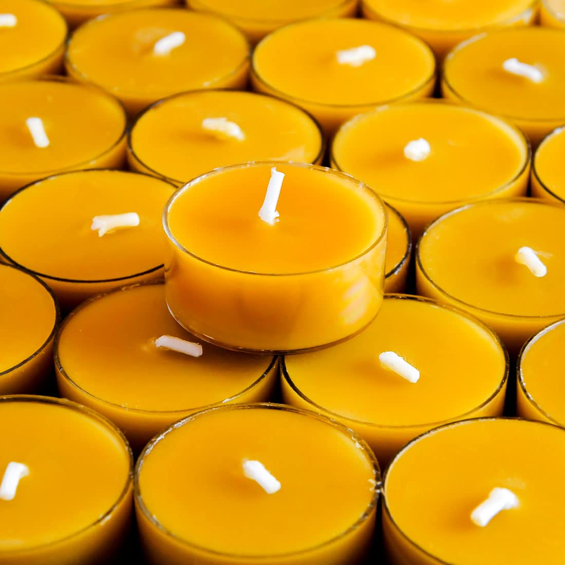 AGLARY tealight next to ruler for size and burn-time scale reference