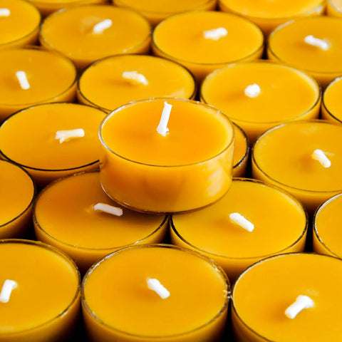 AGLARY tealight next to ruler for size and burn-time scale reference