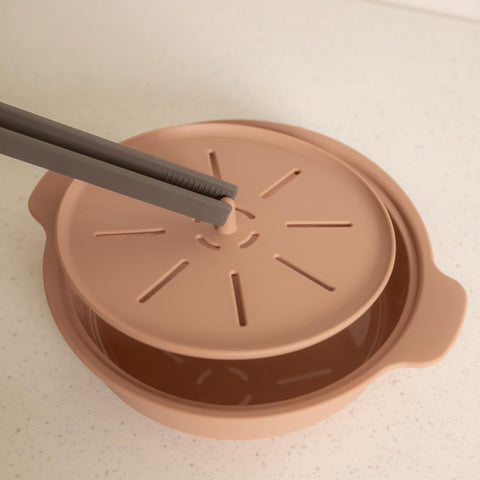 AGUARD beside a mug to show 29oz scale for single-serve convenience