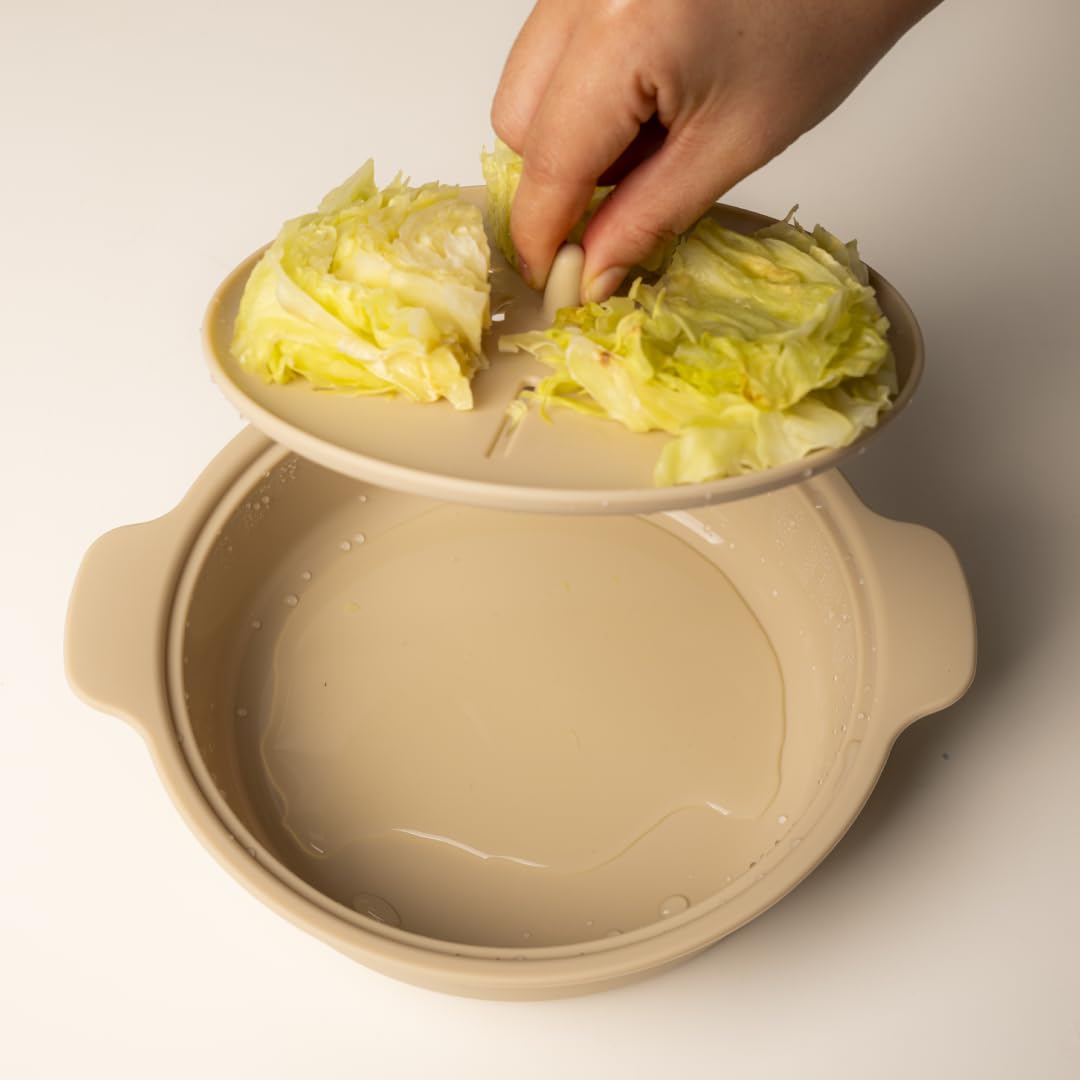 AGUARD steamer with basket of steamed vegetables demonstrating even steaming benefit