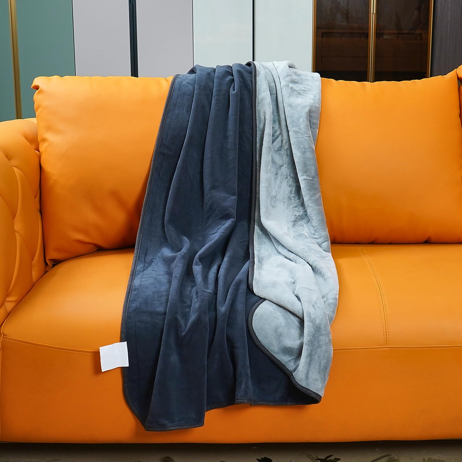 Ahinahwap front view showing dark grey reversible waterproof blanket protecting furniture