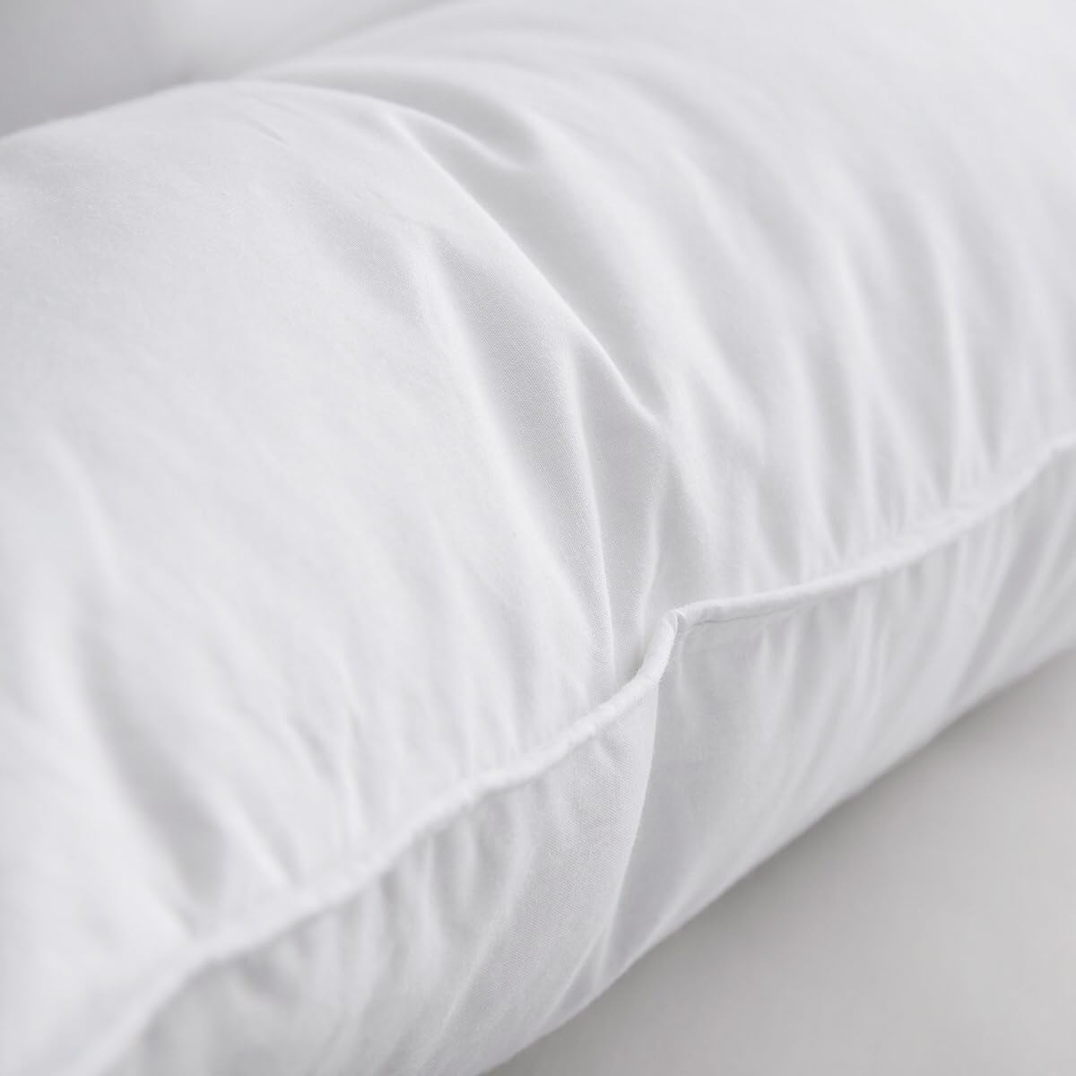 AIKOFUL rolled packaging being unboxed to restore pillow loft