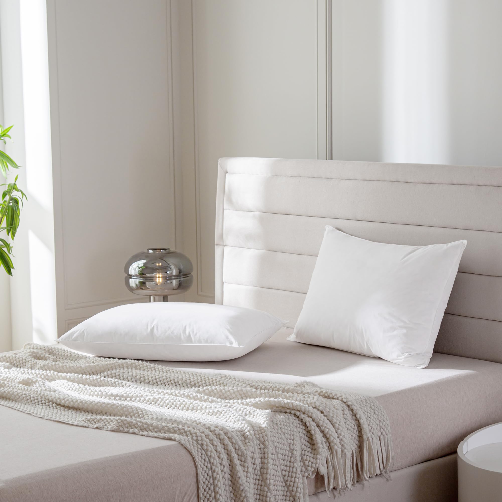 AIKOFUL pillow in bedroom setting illustrating breathable comfort and styling