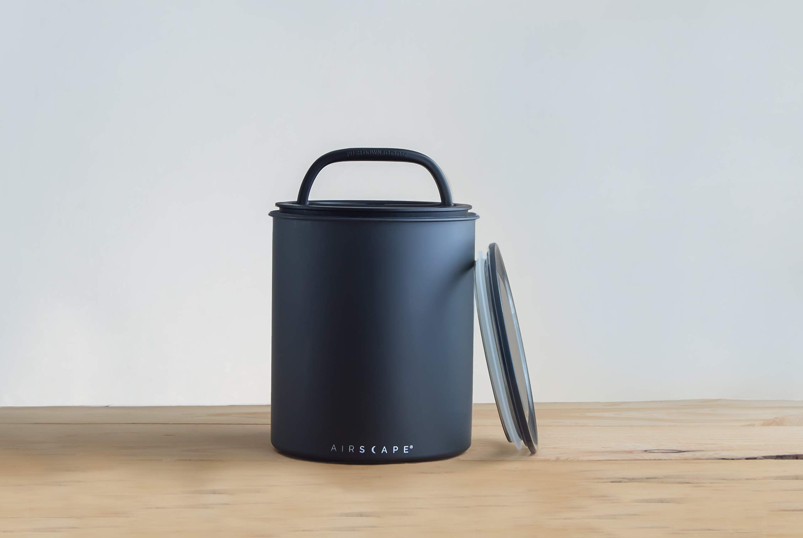 AirScape in use with coffee beans being compressed to extend flavor retention