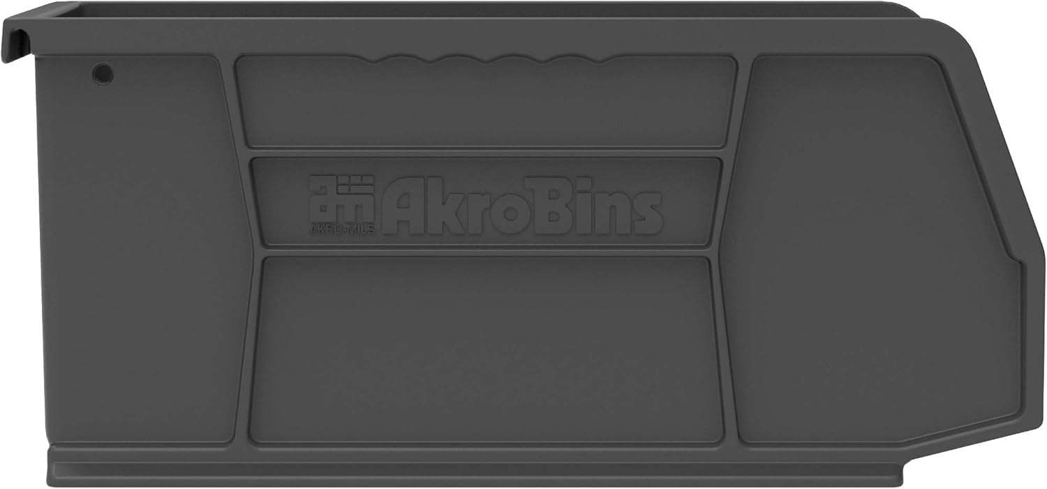 Akro-Mils bin held in hand for scale showing compact footprint benefit