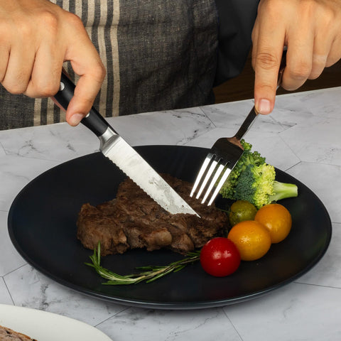 Alata knife beside ruler showing 4.7-inch blade for accurate size comparison