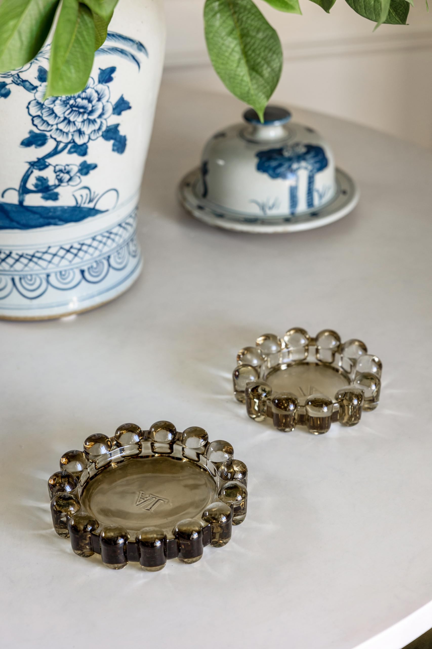 Alice Lane amber bubble dish grouped with decor creating a curated vignette