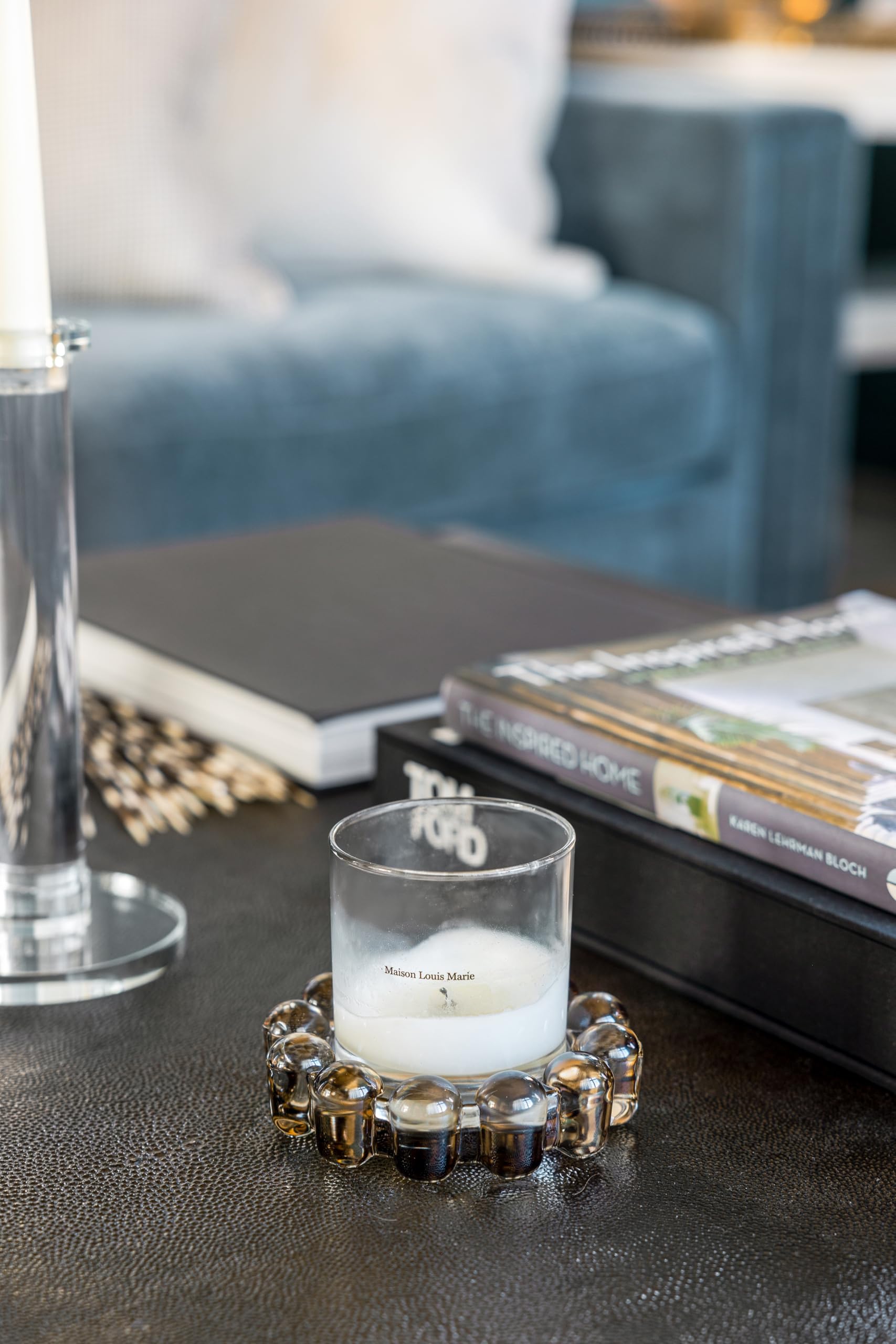 Alice Lane amber bubble dish with pillar candle in room adding ambient light
