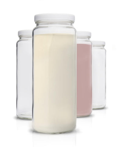 All About Juicing front view of four 32 oz bottles showing clear glass and lids, neat storage benefit
