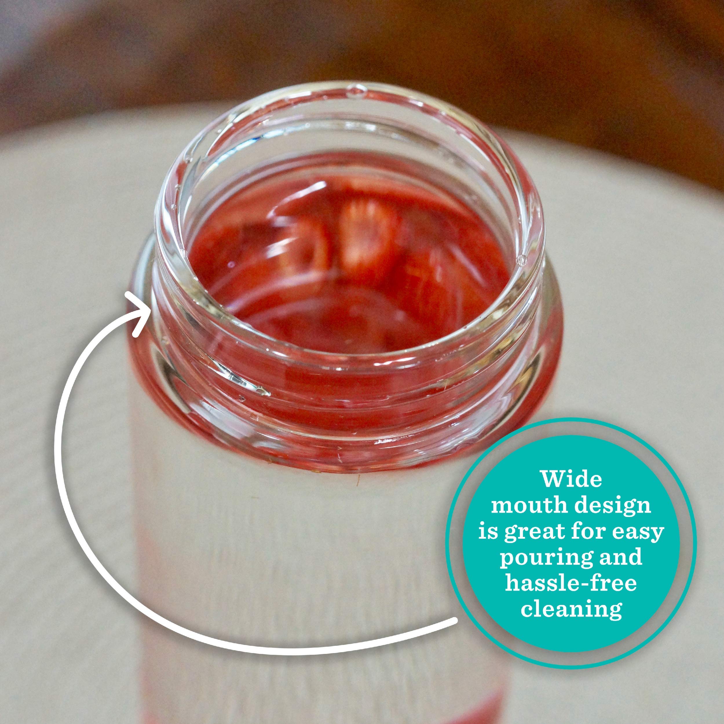 All About Juicing bottle filled with ice and fruit showing attractive presentation