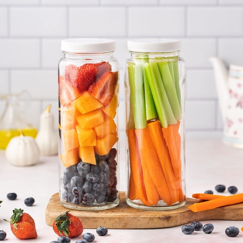 All About Juicing bottle held in hand for size comparison, conveys true 32 oz capacity