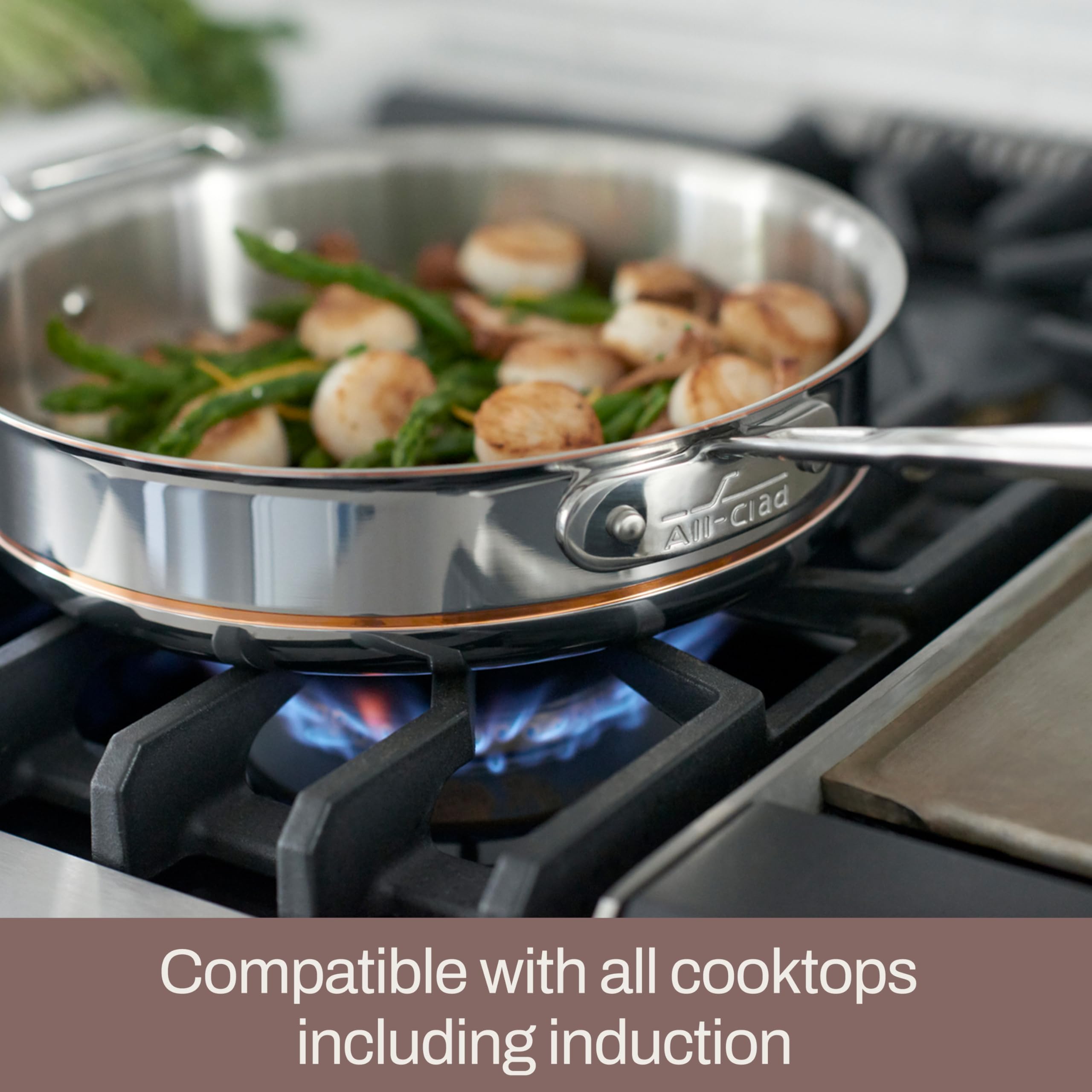 All-Clad copper core handle cutout detail offering secure grip and cooler-hold benefit
