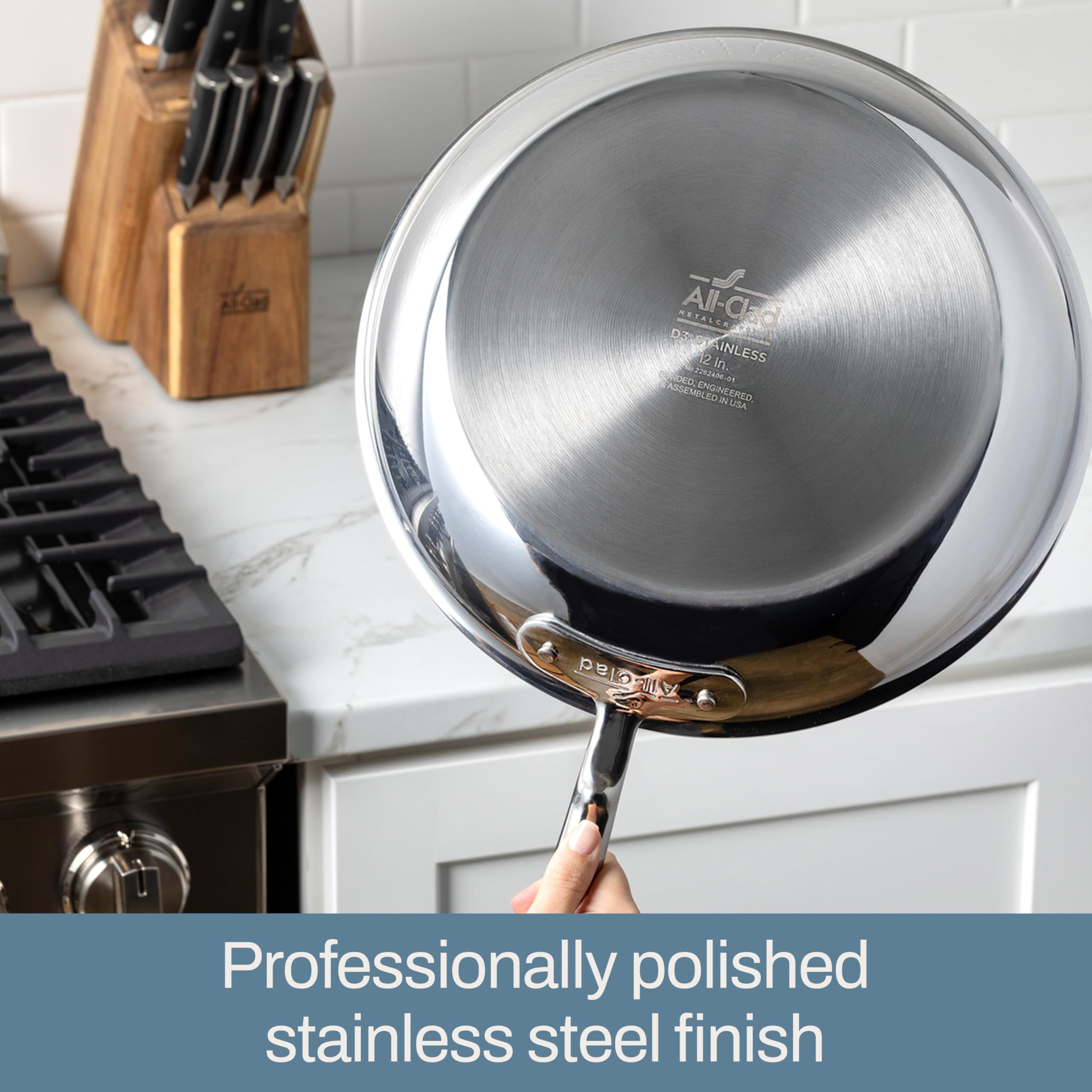 All-Clad pan searing steaks demonstrating high-heat browning benefit