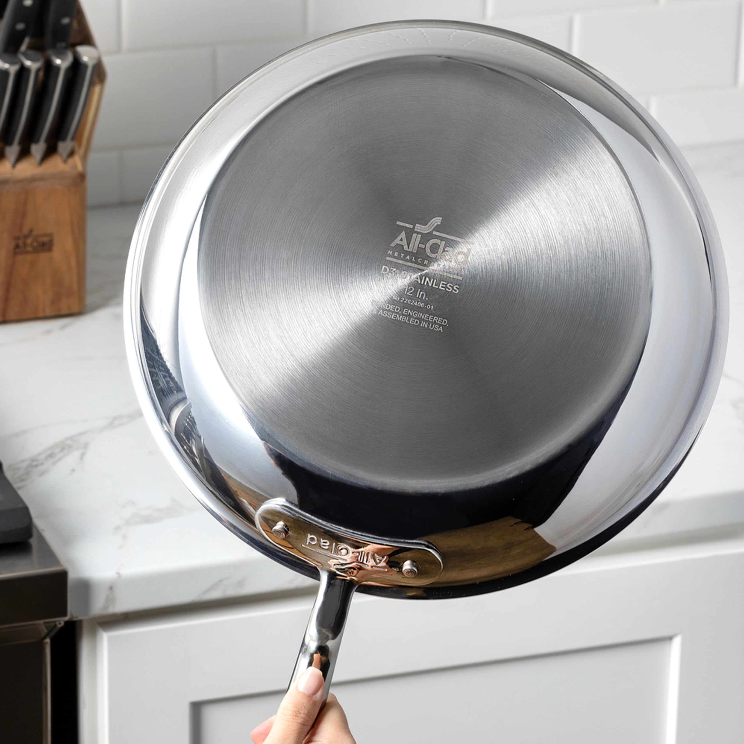 All-Clad D3 saucepan on induction cooktop demonstrating compatibility and even heating