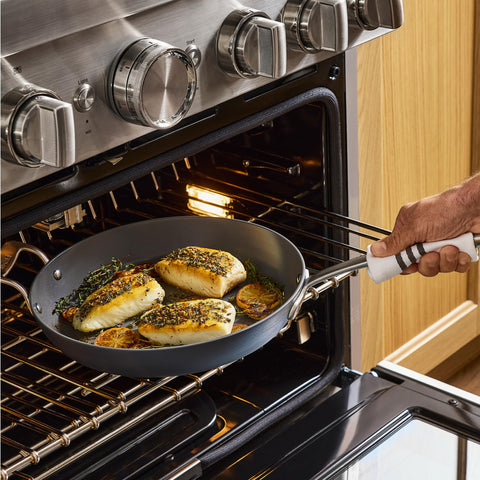 All-Clad HA1 searing steak in pan demonstrating high-heat performance benefit