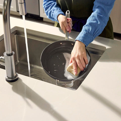 All-Clad HA1 next to spatula showing 12-inch scale for everyday cooking portions