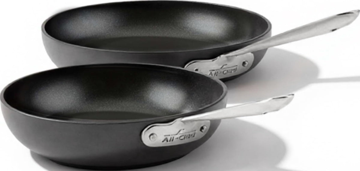 All-Clad HA1 front view set showing both pans and sleek exterior benefit even cooking