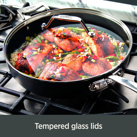 All‑Clad HA1 saucepan beside measuring cup to illustrate 2.5 and 4 quart scale