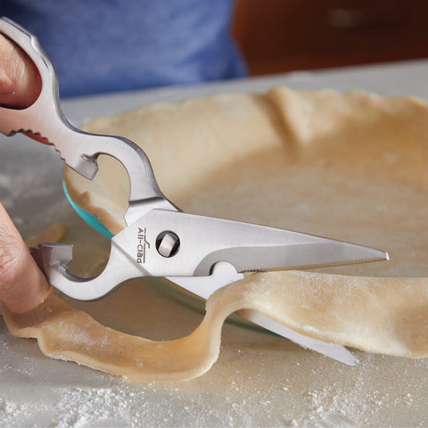 all-clad in use cutting herbs to show efficient food preparation benefit